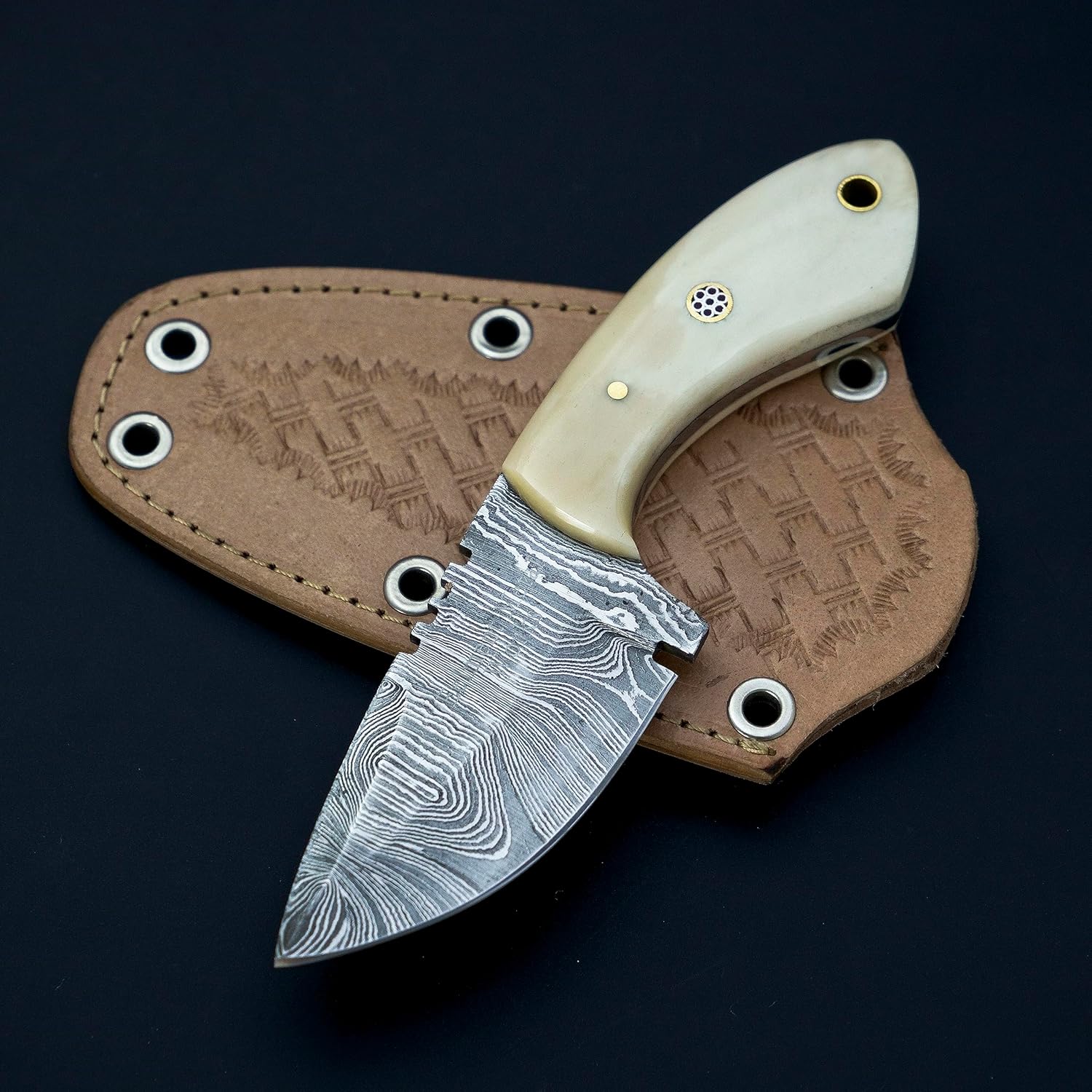 Custom handmade skinning knife with a 3-inch Damascus steel blade and a camel bone handle, featuring a leather sheath for safe storage