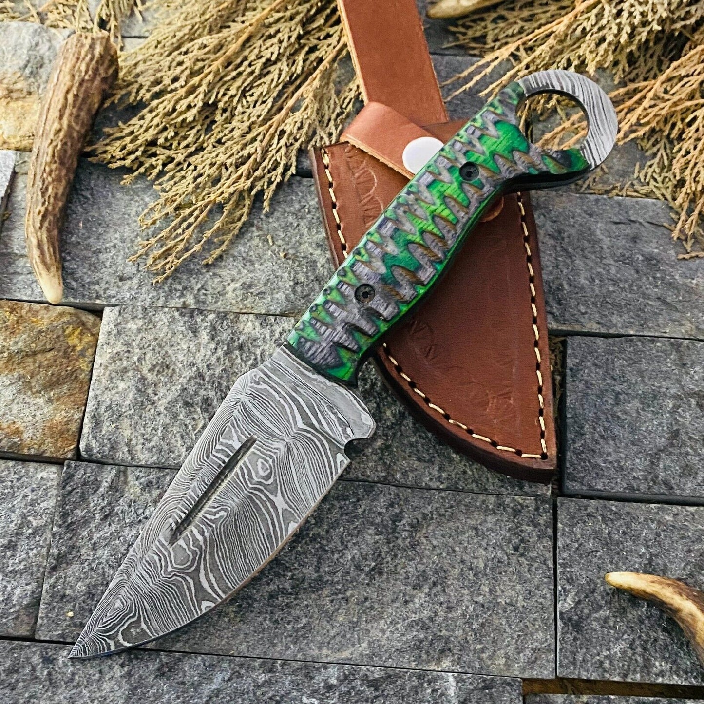 Custom handmade small hunting knife with a 4-inch Damascus steel blade and pakkawood handle, perfect for outdoor use and gifting.