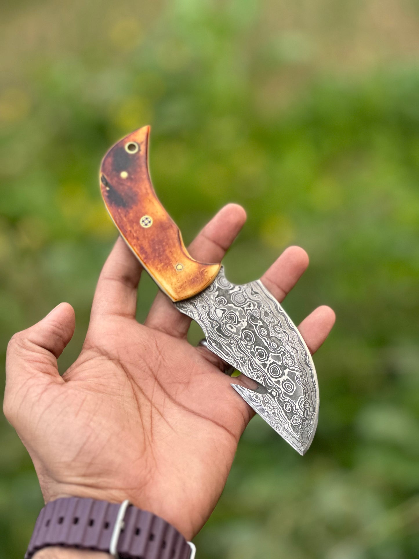 Damascus guthook skinning knife with a camel bone handle, ideal gift item with leather sheath
