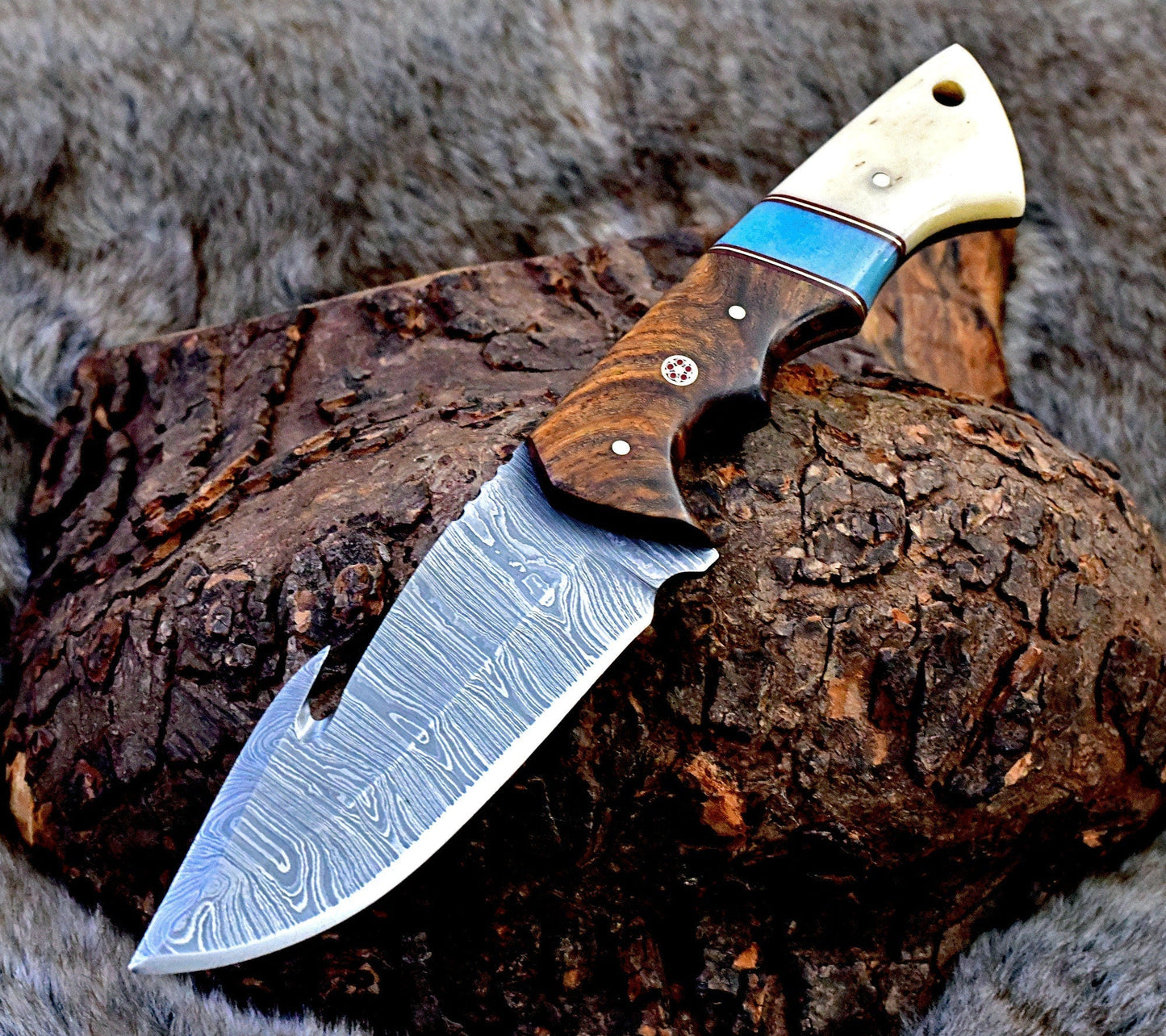 Damascus guthook skinning knife with rosewood and bone handle, 10" overall length.