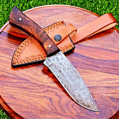 "Damascus steel hunting knife with rosewood handle and leather sheath"