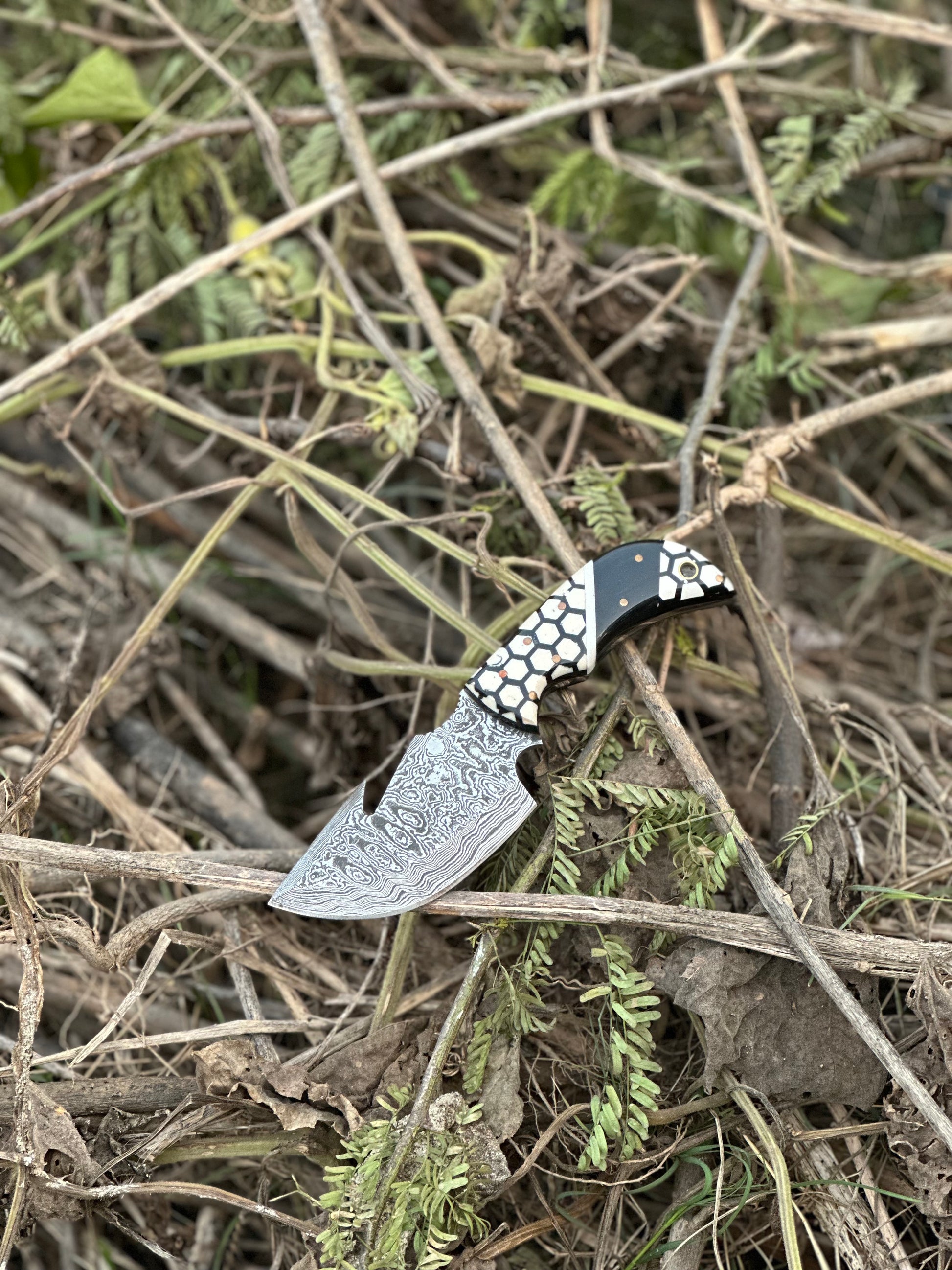 Exquisite custom handmade Damascus steel guthook knife with a unique resin handle and leather sheath