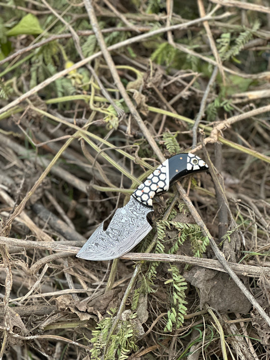 Exquisite custom handmade Damascus steel guthook knife with a unique resin handle and leather sheath