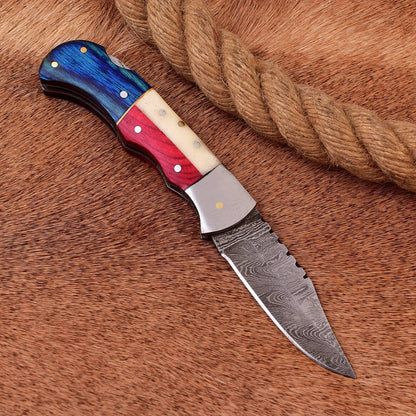 "Handcrafted 3-inch Damascus steel pocket knife featuring Texas flag design"