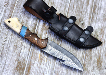 Handcrafted Damascus guthook knife with a rosewood and bone handle, perfect for skinning.