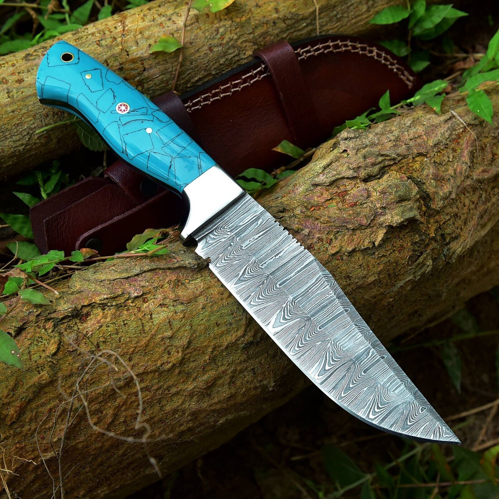 Handcrafted Damascus skinning knife with resin handle and steel bolster, 4.5-inch blade for hunters and collectors