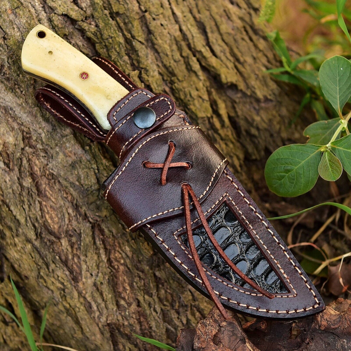 Handcrafted Damascus steel skinner knife with 5-inch blade, camel bone handle, and durable steel bolster for precise outdoor skinning