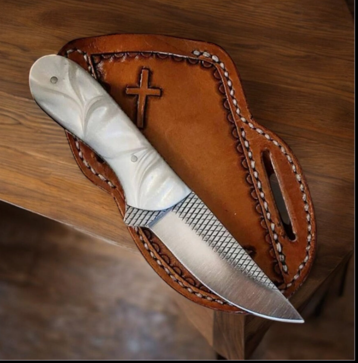 "Handcrafted western belt knife with rasp tool steel blade and resin handle, displayed in a leather sheath."

