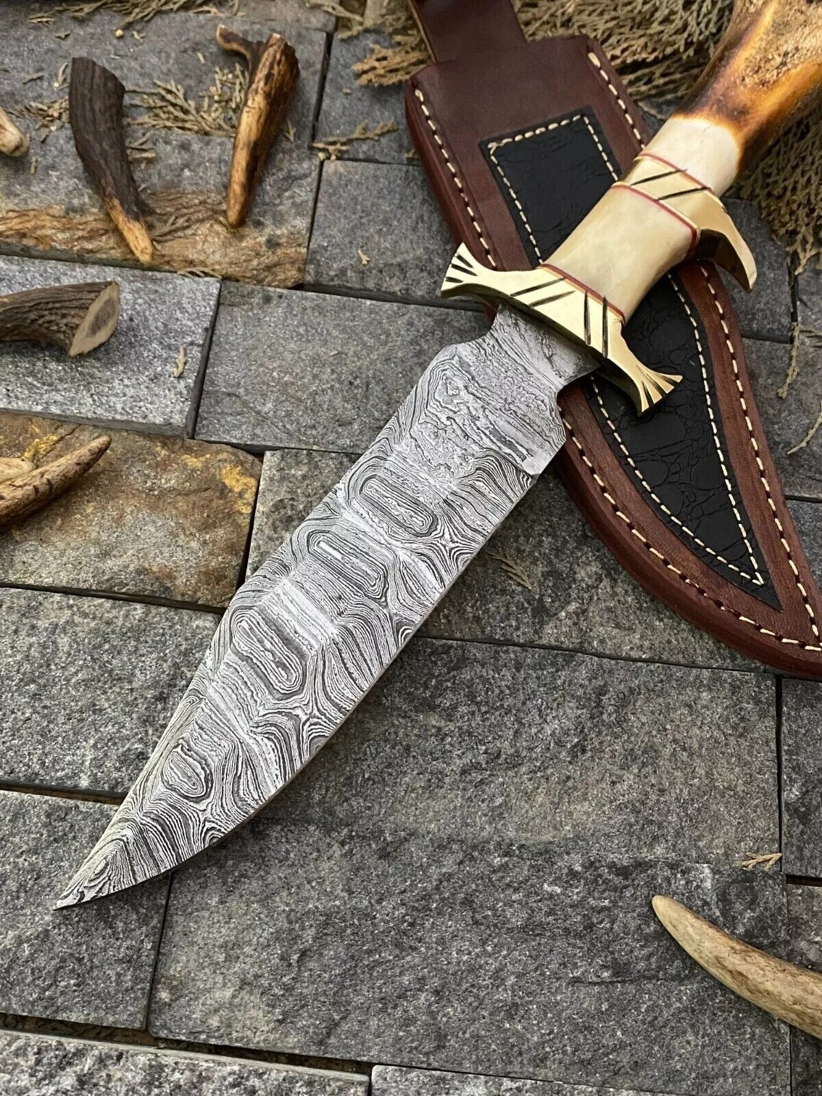 "Handmade Damascus Steel Bowie Knife with 13-inch blade, elegant bone handle, brass guard, and leather sheath for safe storage
