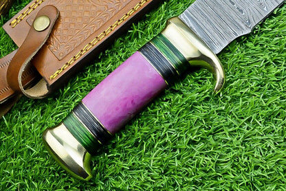 "Handmade Damascus steel bowie knife with leather sheath and pakkawood handle"