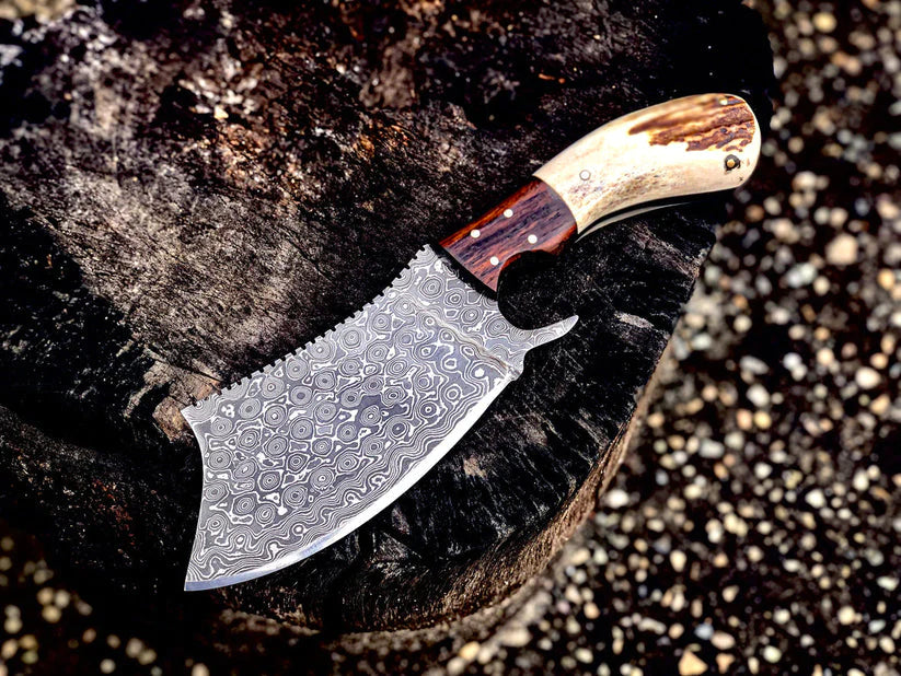 Handmade Damascus steel cleaver knife with antler horn handle and rosewood bolster, featuring a leather sheath