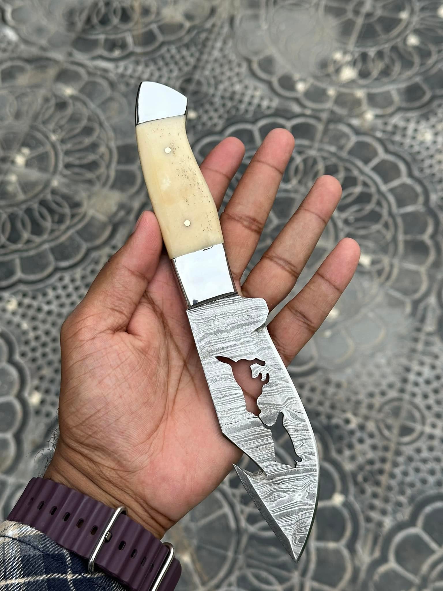 Handmade Damascus steel knife with 5-inch blade and camel bone handle in leather belt sheath