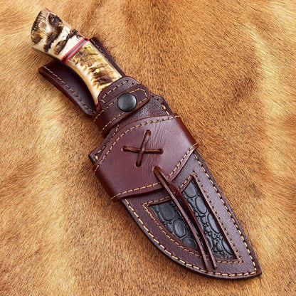 Handmade Damascus steel skinning knife with 4.5-inch blade and sheep horn handle, ideal for hunters and collectors