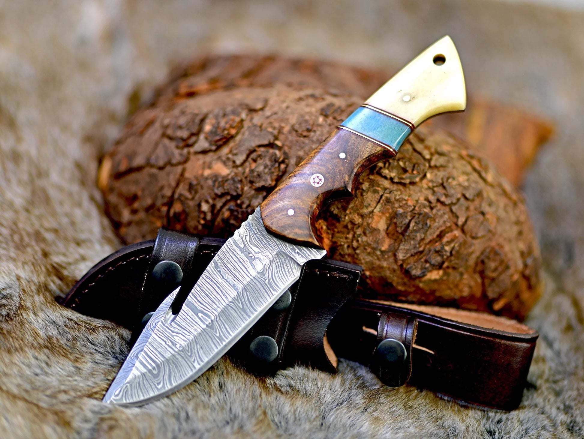 Premium Damascus steel guthook skinning knife with a rosewood and bone handle.