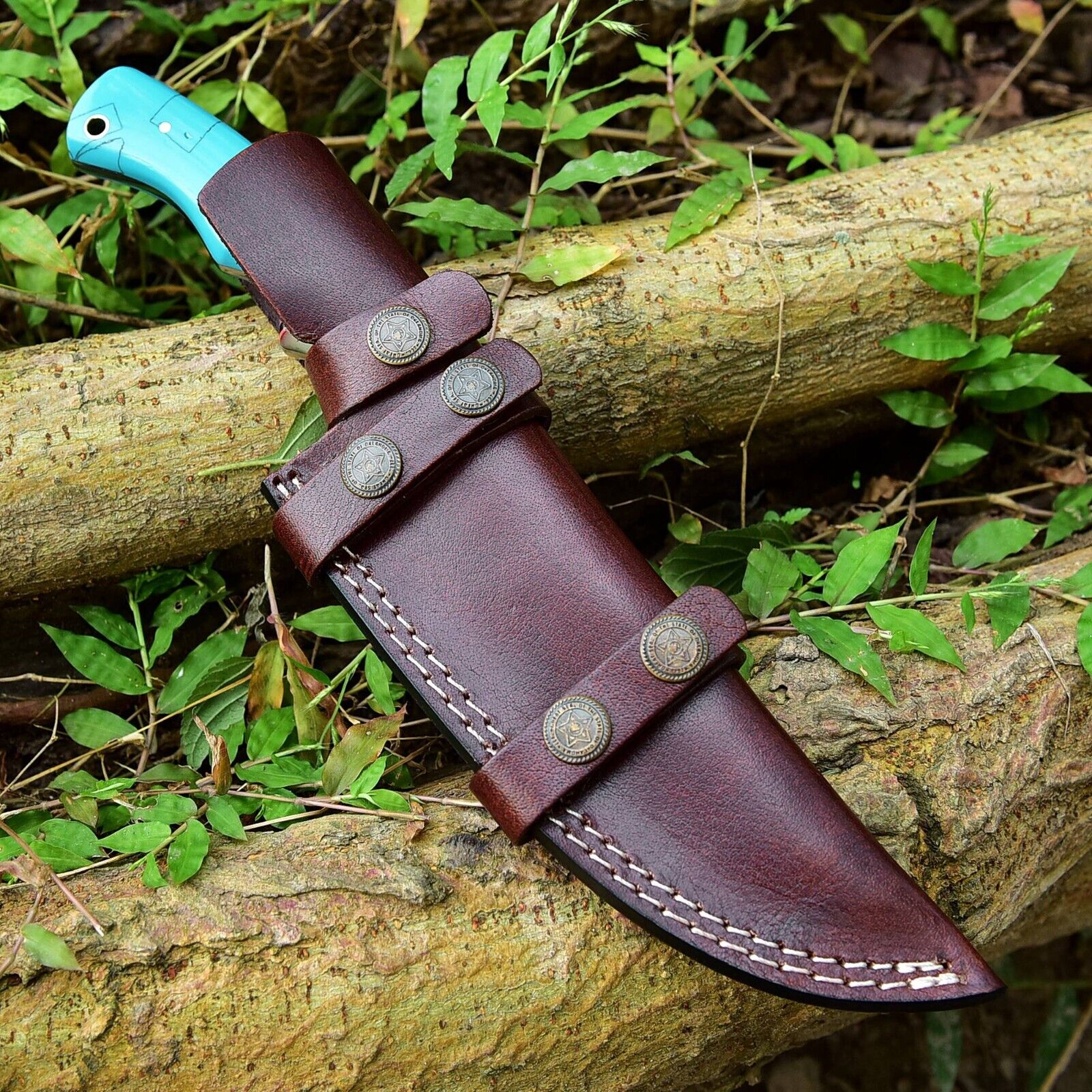 Premium Damascus steel hunting knife with 10-inch blade, resin handle, and a stylish leather sheath for safe storage