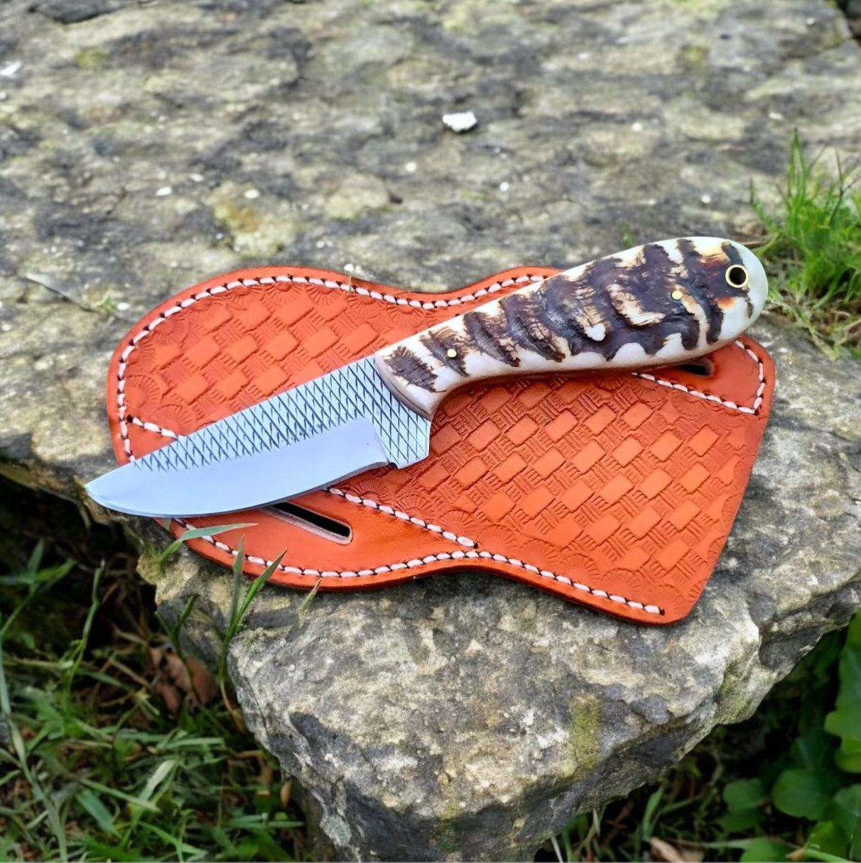 "Ranch Cowboy Knife with sheep horn handle and leather belt loop case, showcasing rustic design and durability for ranch tools."

