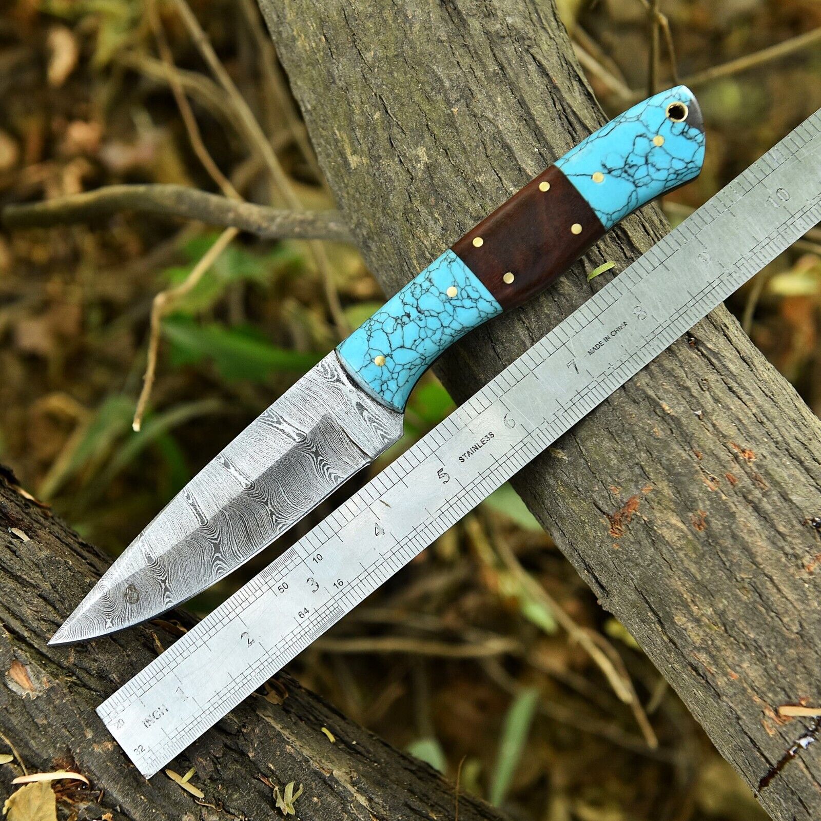 Small hunting knife featuring resin and rosewood handle
