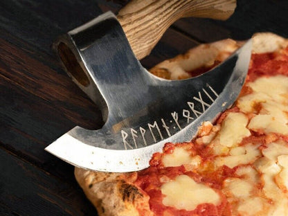 Stylish custom ax pizza cutter slicing pizza