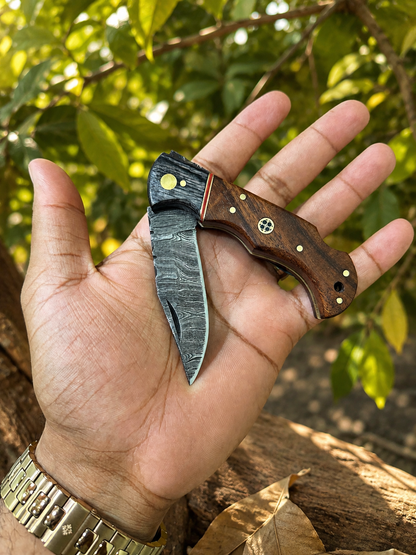 Traditional pocket knife with 6-inch overall length, rosewood or pakkawood handle and handmade leather sheath
