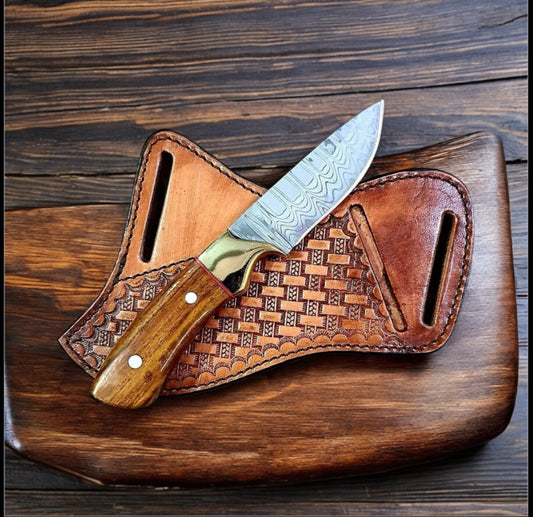 "Western fixed blade knife with Damascus steel blade and rosewood handle on leather case."

